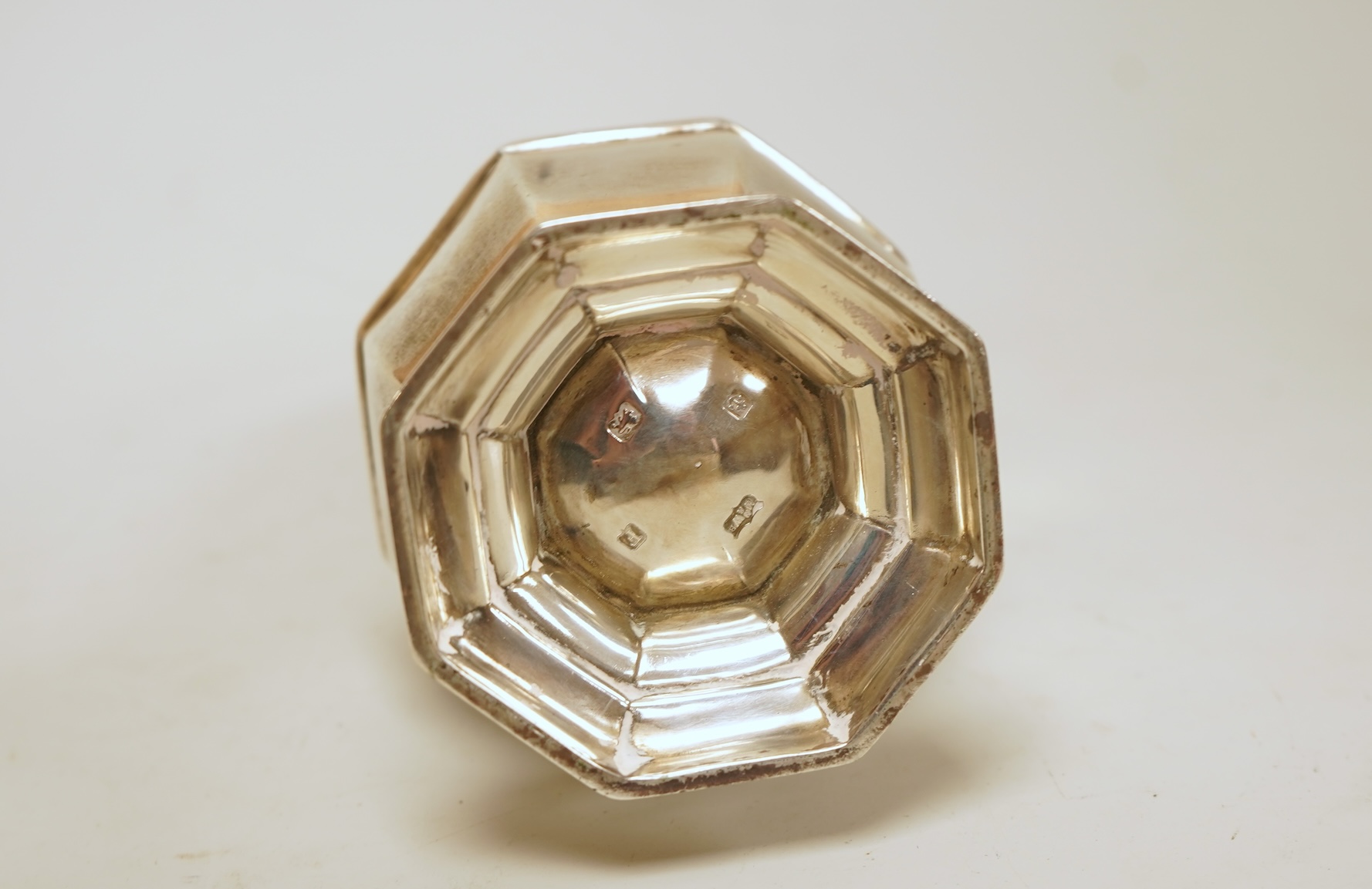 A George V silver octagonal silver sugar caster, by Mappin & Webb, Birmingham, 1930, height 16.7cm, 4.4oz.